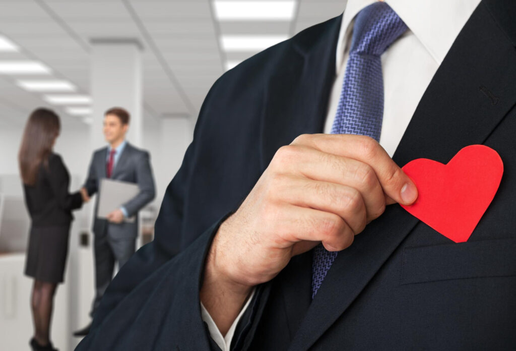 Business Man Suit Holding Paper Red Heart Close Up Colleagues Background