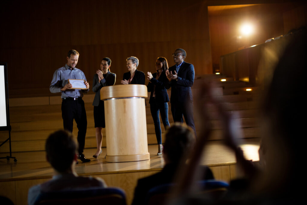 Male Business Executive Receiving Award